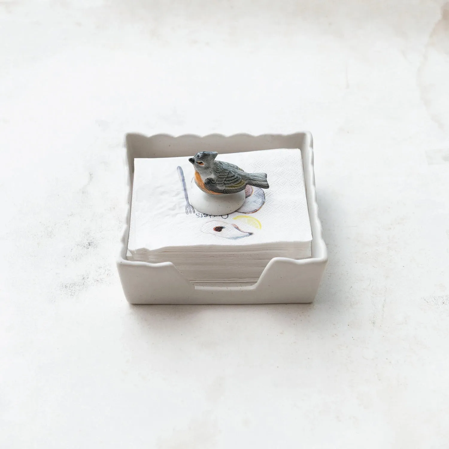 NAPKIN HOLDER WITH STONEWARE BIRD WEIGHT